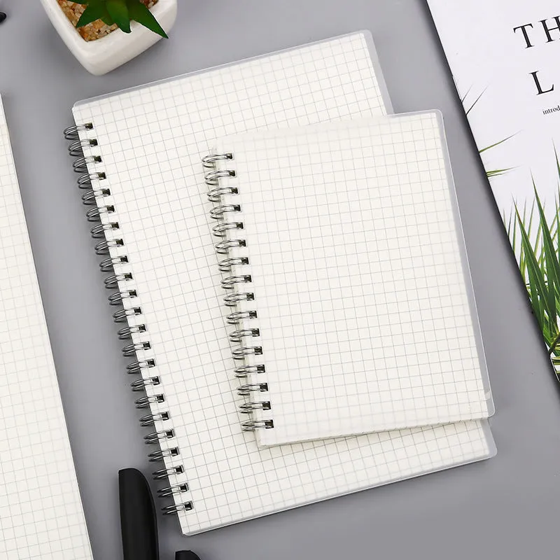 Creative coil-bound notebook open showing grid dot matrix pages, with PP matte cover in A5 size.