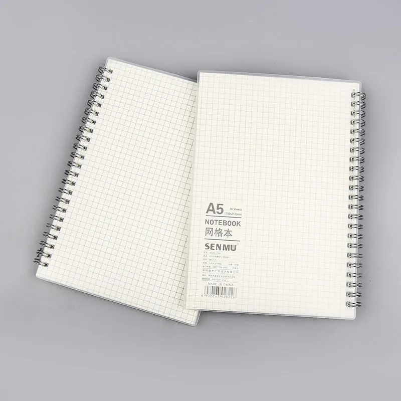 Creative coil-bound notebook open showing grid dot matrix pages, with PP matte cover in A5 size.