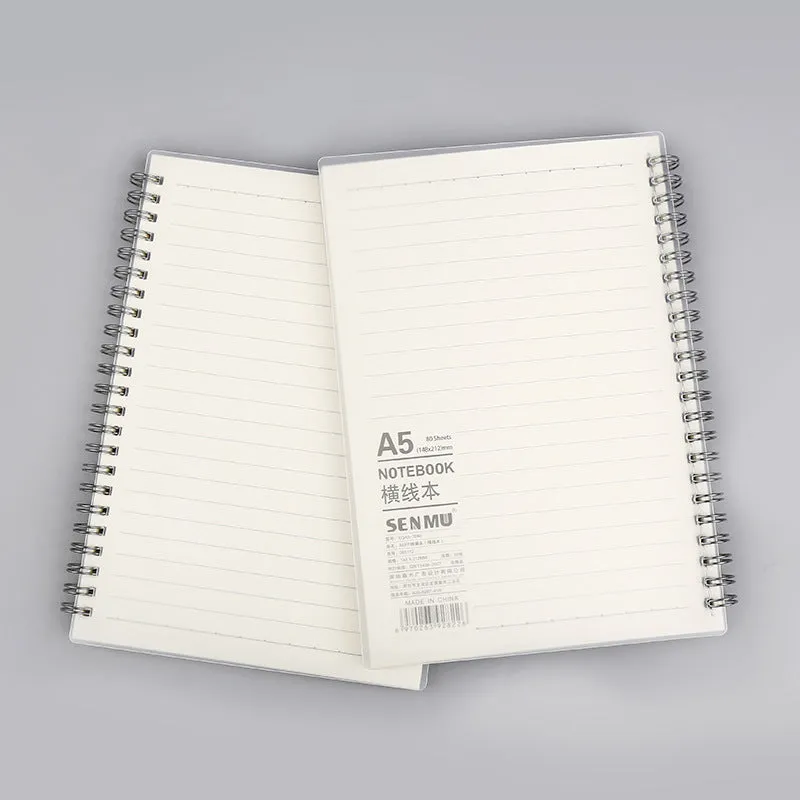 Creative coil-bound notebook open showing grid dot matrix pages, with PP matte cover in A5 size.