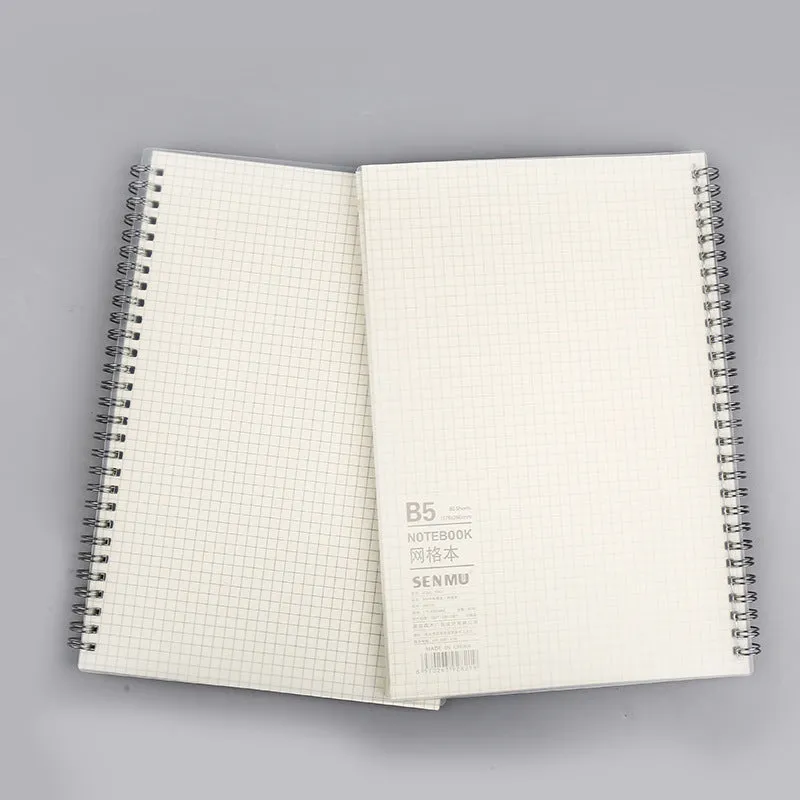 Creative coil-bound notebook open showing grid dot matrix pages, with PP matte cover in A5 size.