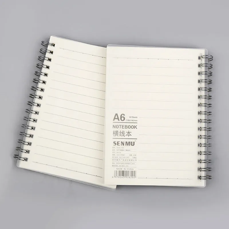 Creative coil-bound notebook open showing grid dot matrix pages, with PP matte cover in A5 size.
