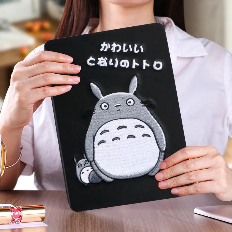 Cartoon design silicone protective sleeve for iPad with imitation leather finish and included screen protector.