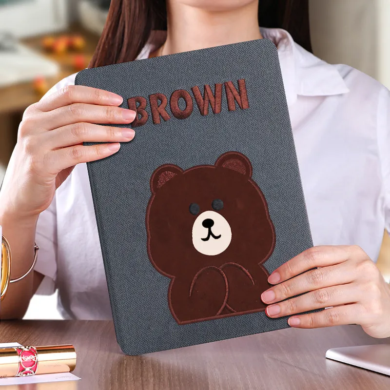 Cartoon design silicone protective sleeve for iPad with imitation leather finish and included screen protector.