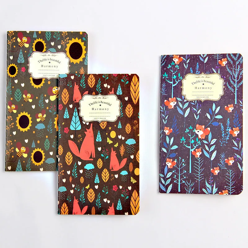 Kraft paper notebook with tassel bookmark showing hand-stitched binding and blank interior pages