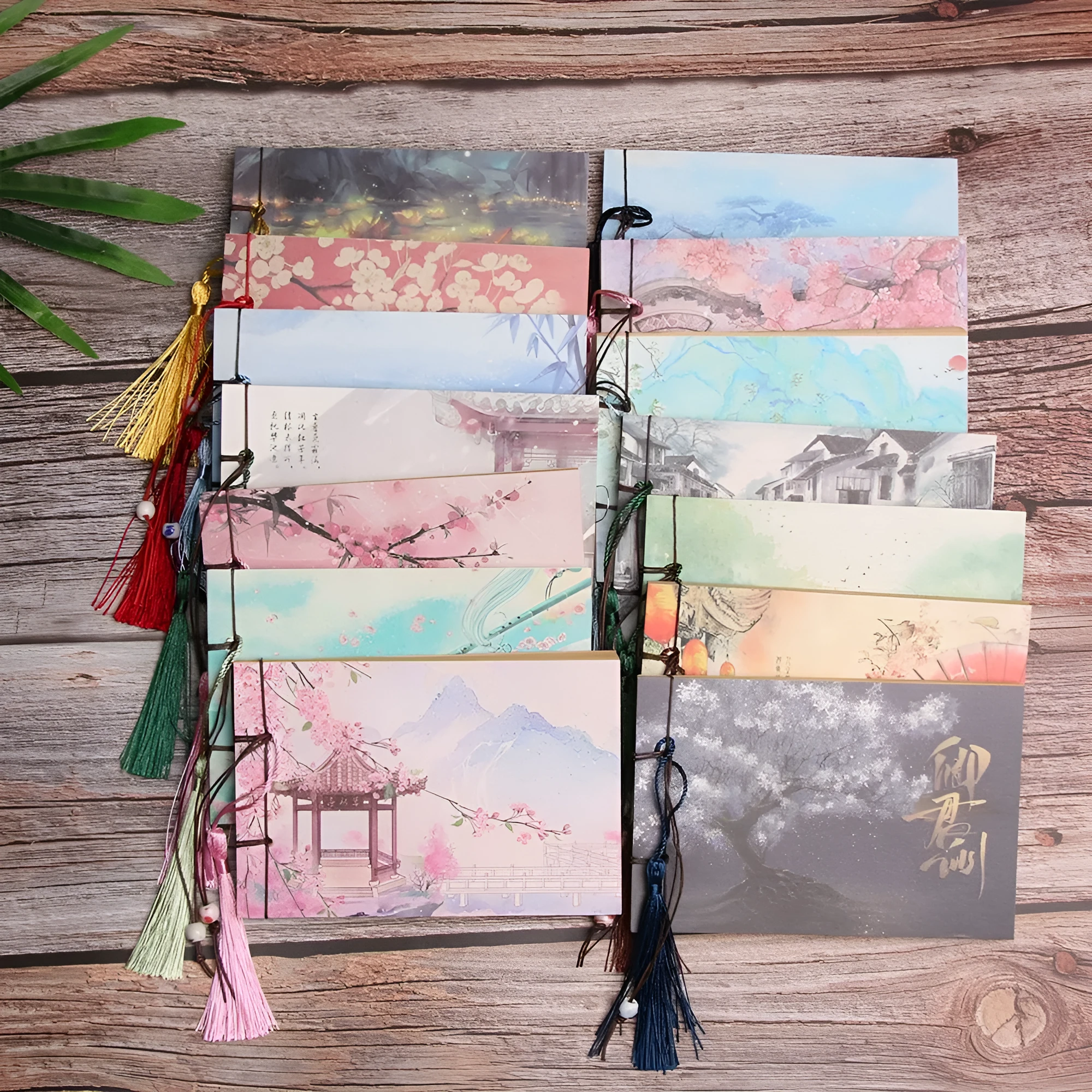 Kraft paper notebook with tassel bookmark showing hand-stitched binding and blank interior pages