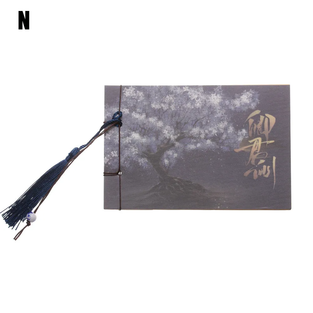 Kraft paper notebook with tassel bookmark showing hand-stitched binding and blank interior pages