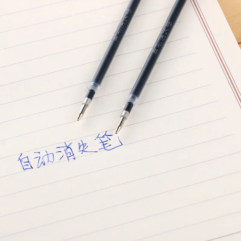 Automatic fade and disappear pen set showing pen holder, case, and eight refill cartridges of vanishing ink