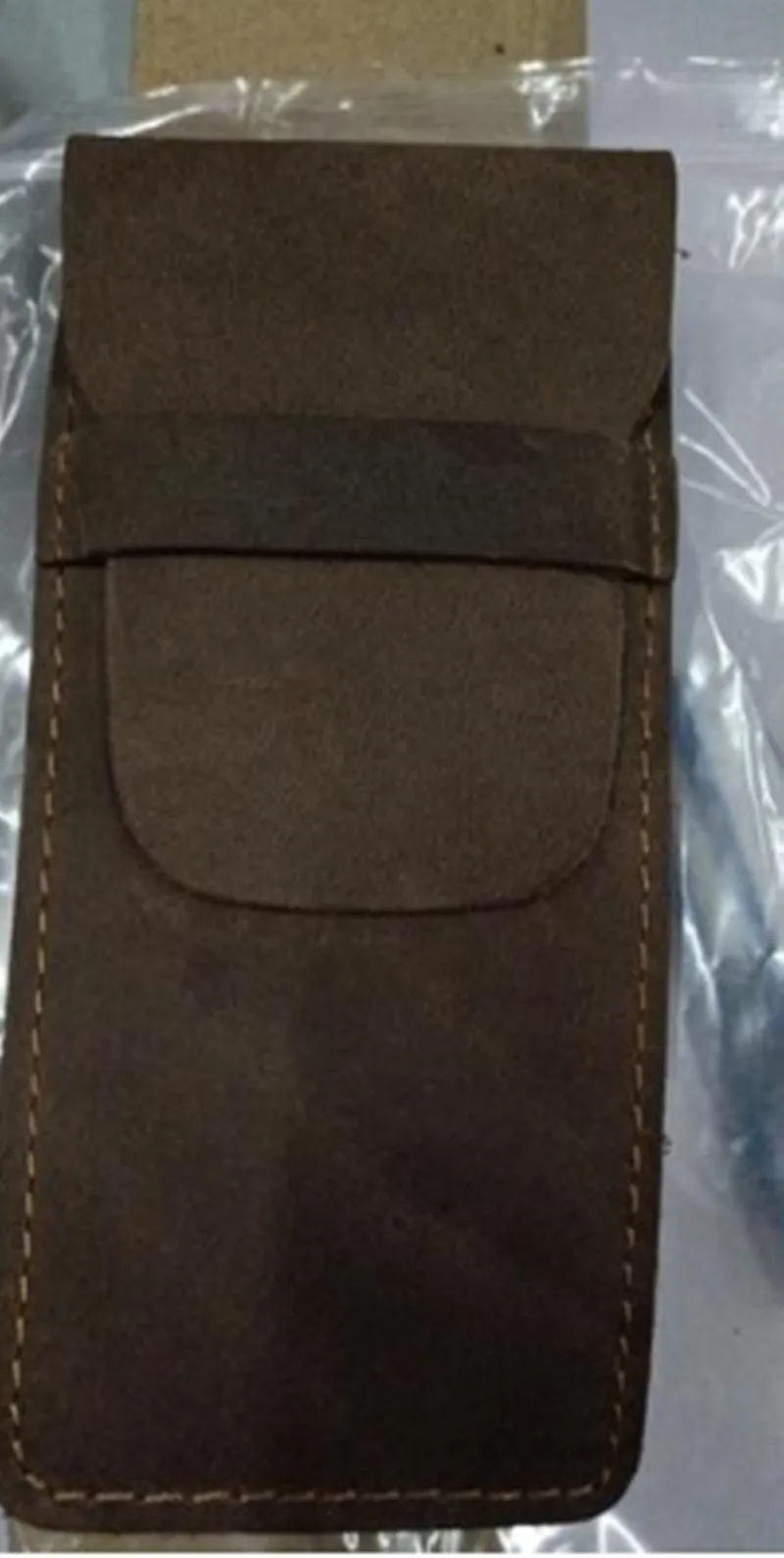 Brown vintage leather pencil case measuring 16x6cm open showing interior