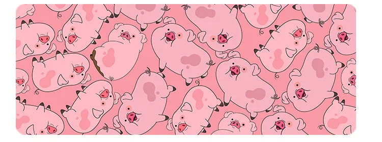 Oversized cat head design desk mat in various colours and sizes on a wooden desk.