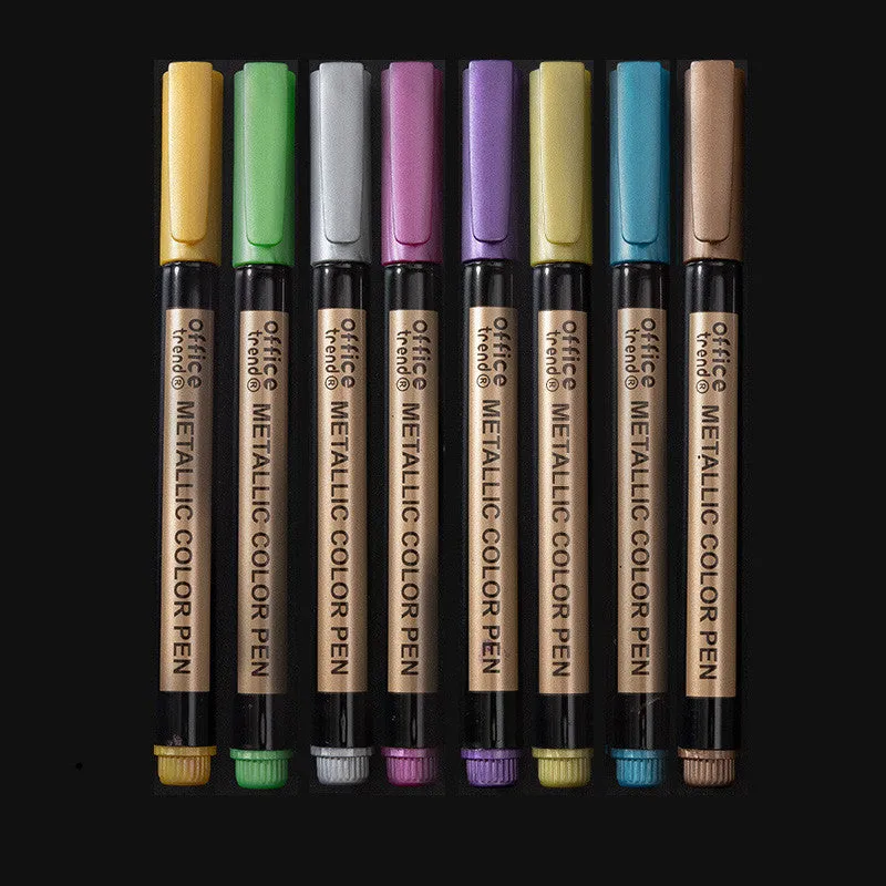 Set of Shiny Metal Quicksand gel pens in assorted metallic and pearlescent colours on dark paper.
