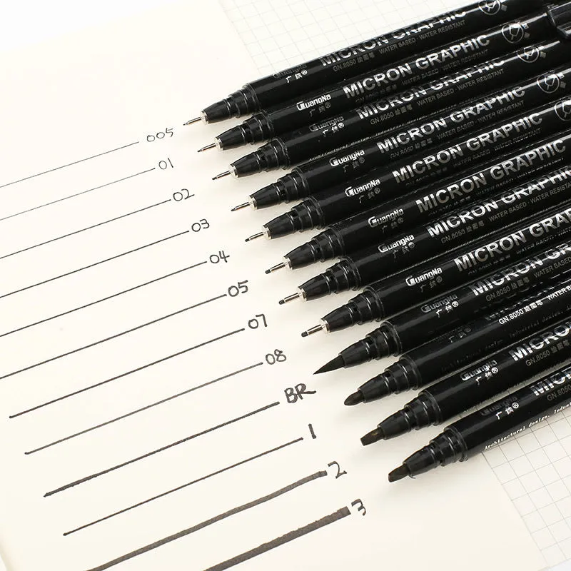 Set of 12 black comic drawing pens with various nib sizes stored in a fabric organiser bag.