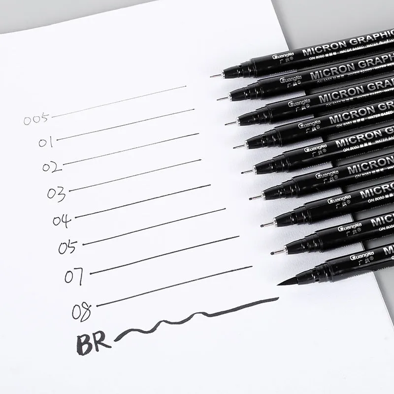 Set of 12 black comic drawing pens with various nib sizes stored in a fabric organiser bag.