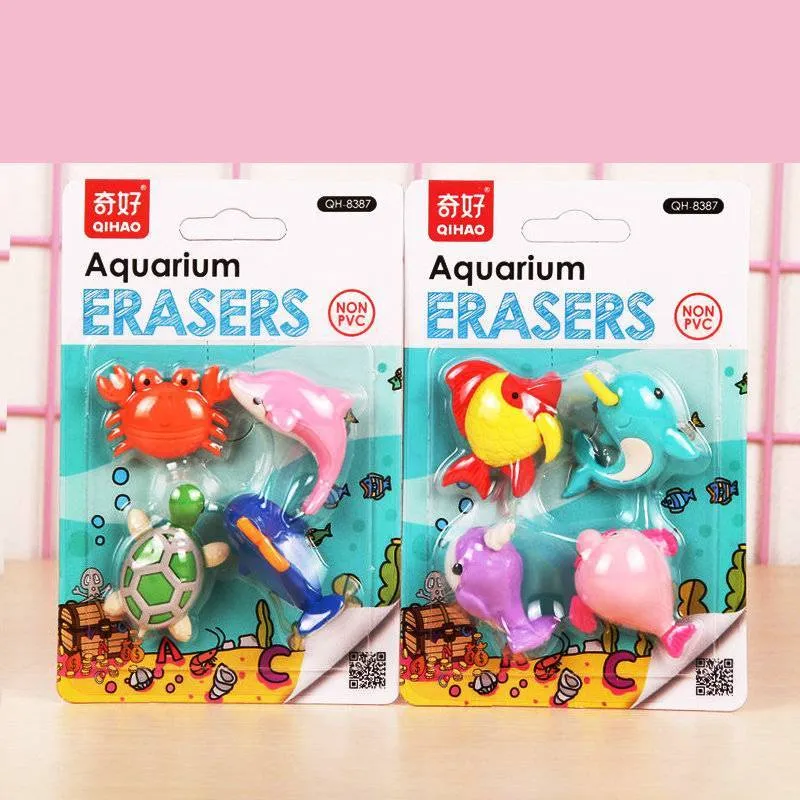 Assorted mini novelty erasers in shapes of cars, animals, food, and fantasy themes on a white background.