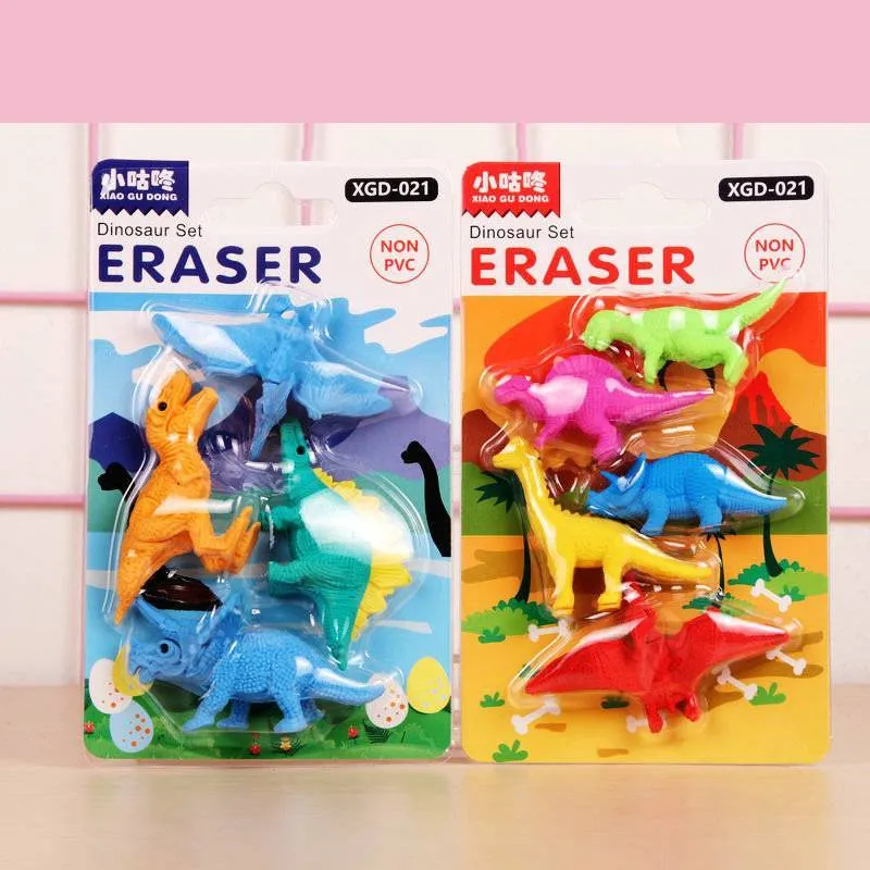 Assorted mini novelty erasers in shapes of cars, animals, food, and fantasy themes on a white background.