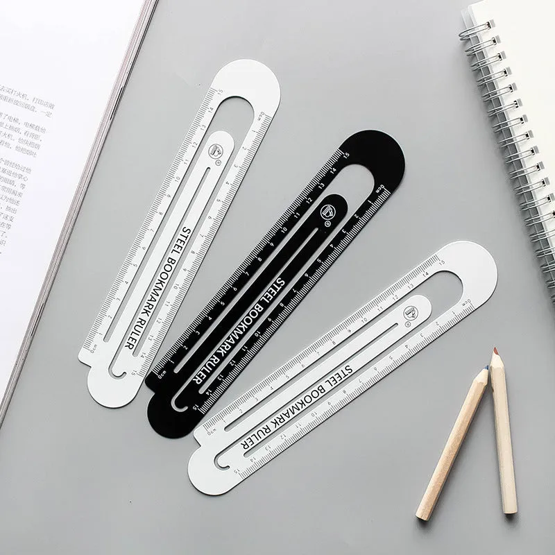Black and white two-sided metal ruler showing 12 cm length scale.