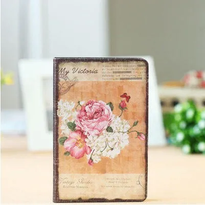Hardcover notebook with retro floral cloth cover in Lily colour, showing 25K size next to 50K size comparison
