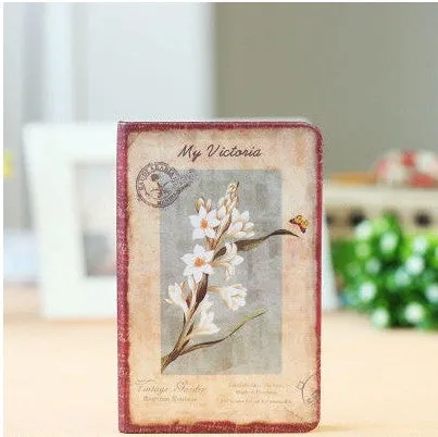 Hardcover notebook with retro floral cloth cover in Lily colour, showing 25K size next to 50K size comparison