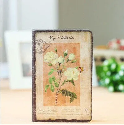Hardcover notebook with retro floral cloth cover in Lily colour, showing 25K size next to 50K size comparison