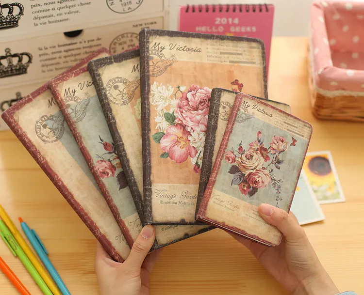 Hardcover notebook with retro floral cloth cover in Lily colour, showing 25K size next to 50K size comparison