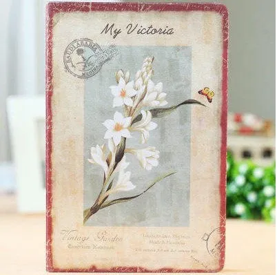Hardcover notebook with retro floral cloth cover in Lily colour, showing 25K size next to 50K size comparison