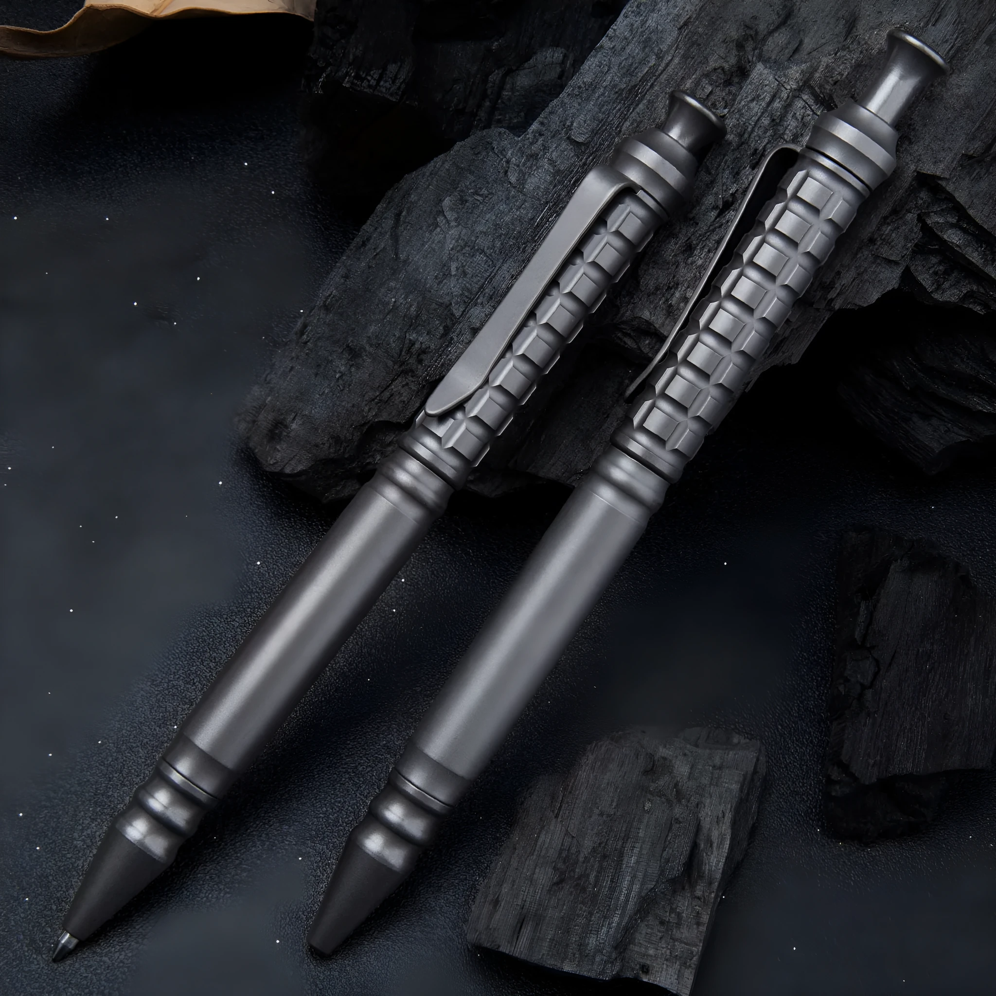 Gunmetal grey titanium tactical pen with push-action mechanism and 0.5mm nib
