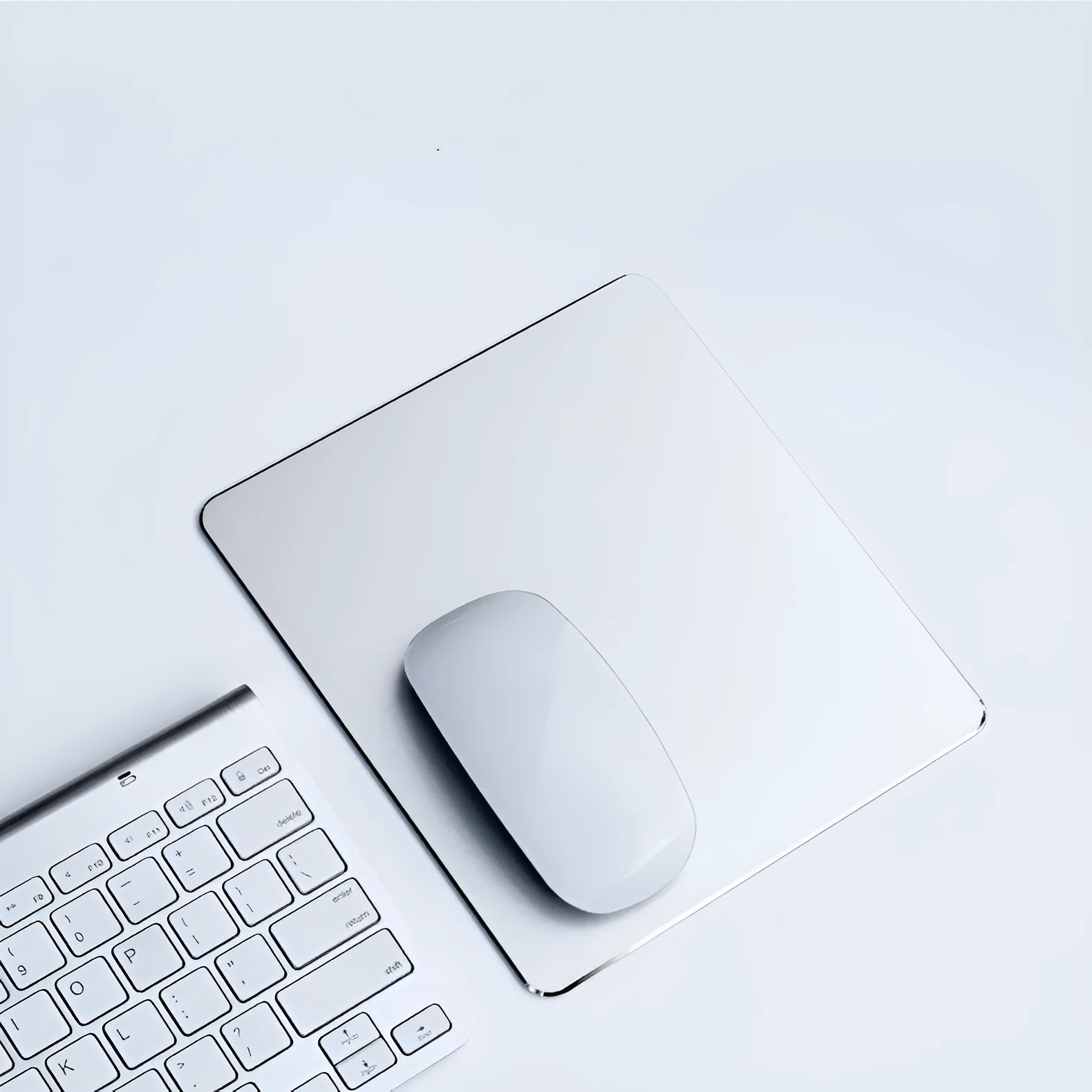 Aluminum alloy double-sided metal mouse pad in black finish with integrated wrist support