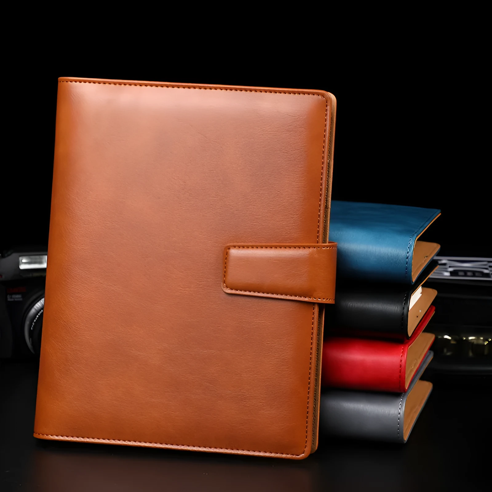 A5 leather buckle notebook with 6-hole clip in multiple colours showing hard cover and closure