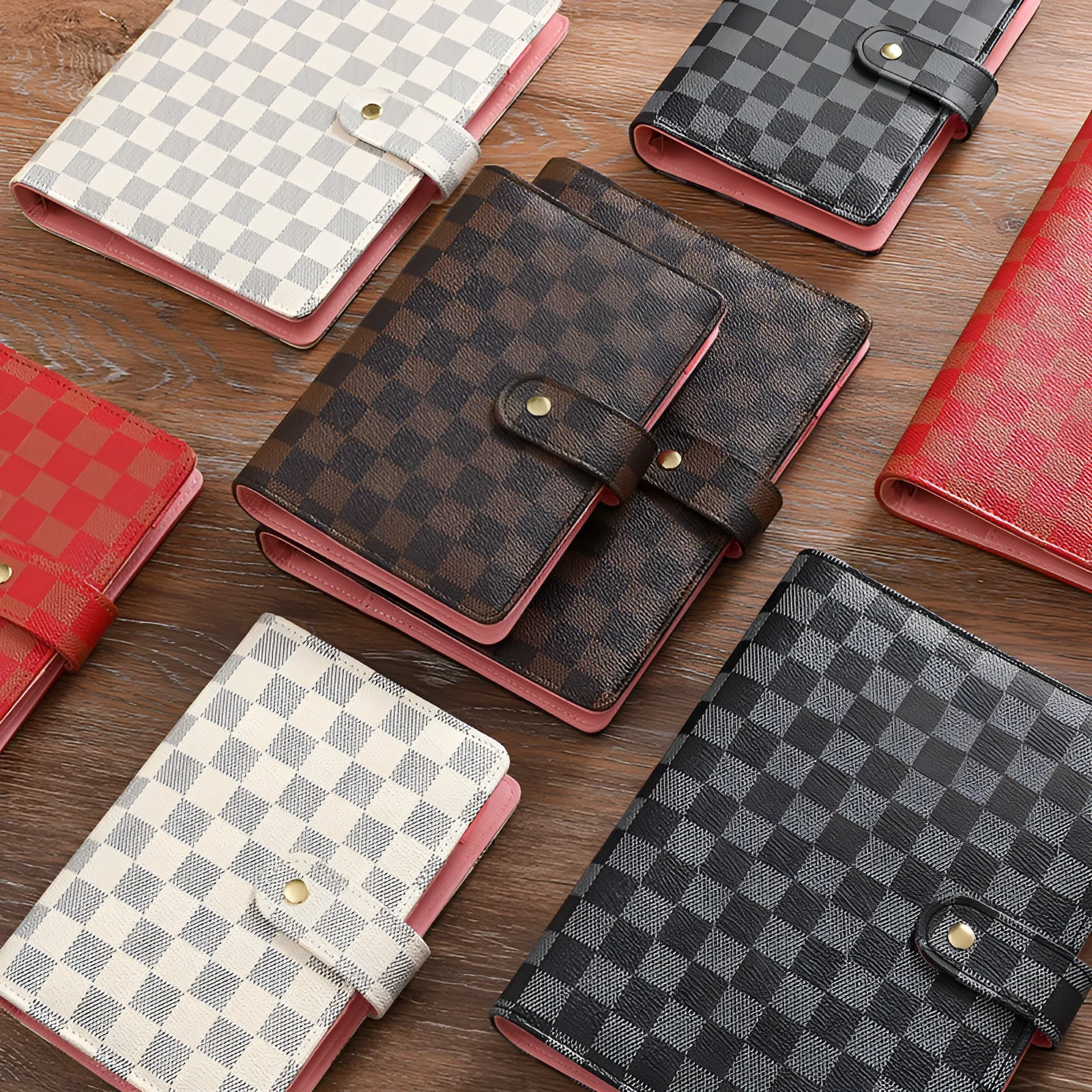 Red checkered imitation leather loose-leaf notebook in A5 size, showing the binding mechanism.