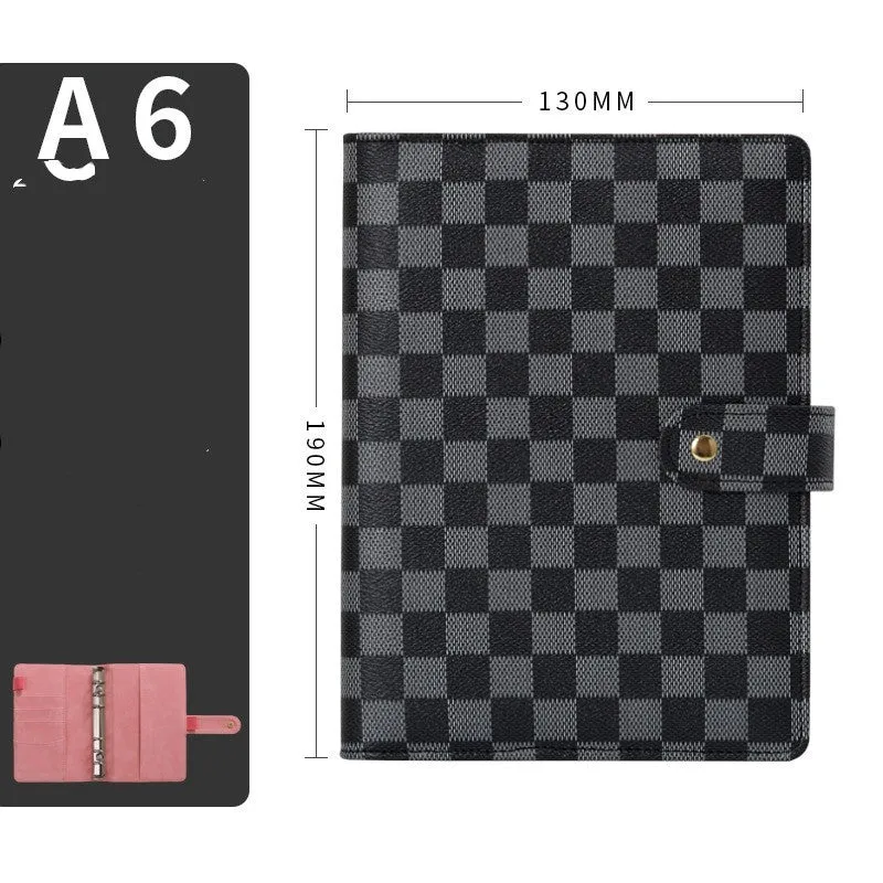 Red checkered imitation leather loose-leaf notebook in A5 size, showing the binding mechanism.