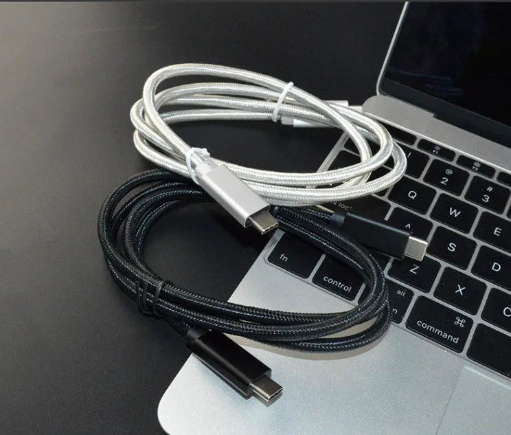 Black USB-C to USB-C cable with stainless steel plug, shown coiled, for 100W charging and 4K video.