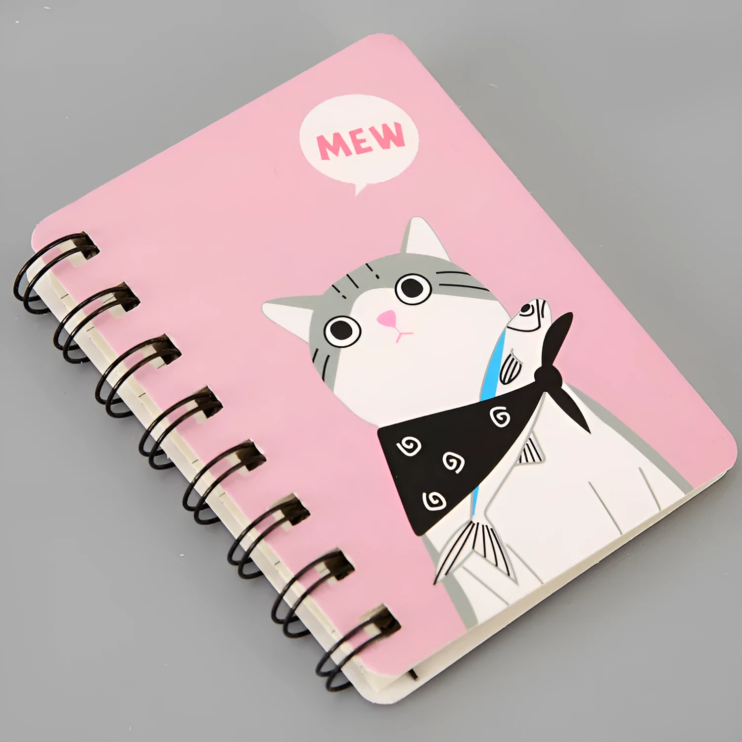 Mini spiral notebook with pen in green, pink, purple, or yellow colours showing 50 pages and 80x105mm size