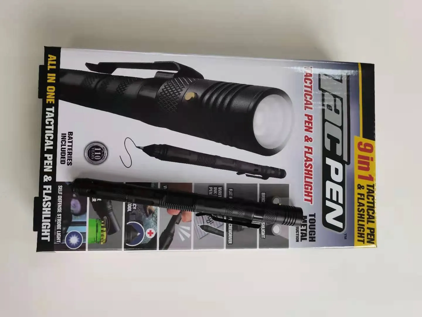 Nine-in-one multi-function flashlight survival pen in black with dual light sources and car window breaker