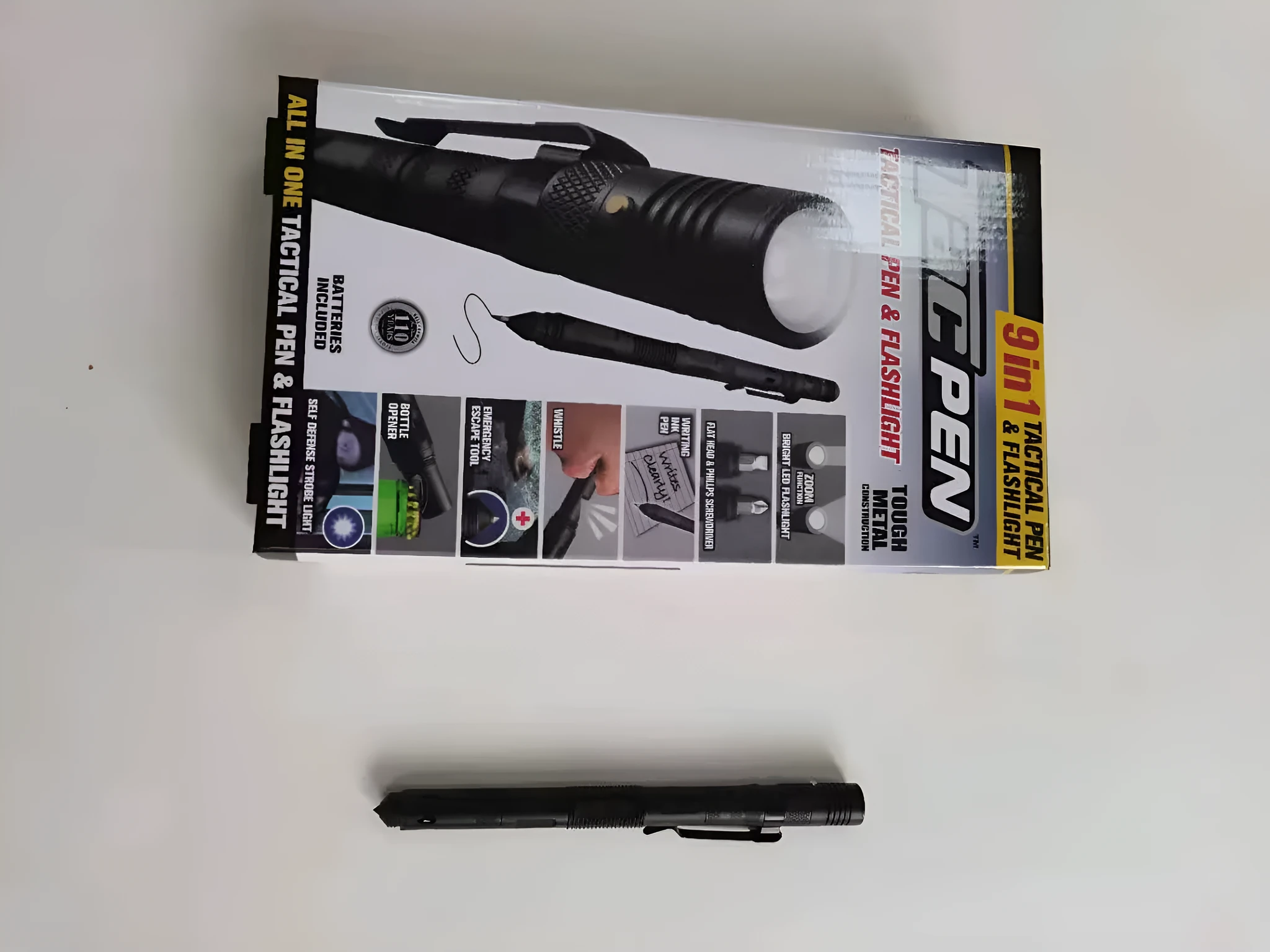 Nine-in-one multi-function flashlight survival pen in black with dual light sources and car window breaker