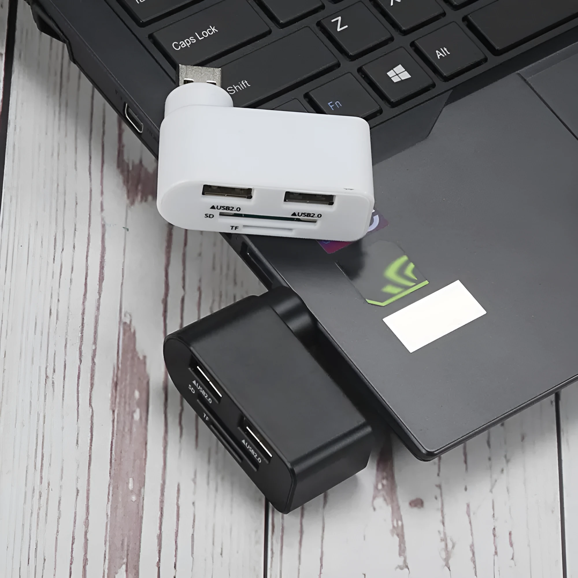Rotating USB 2.0 hub with three ports and multi-format card reader in black ABS plastic