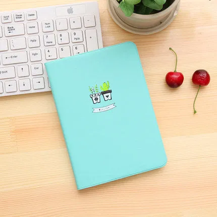 Leather handbook notebook 36K with 112 beige pages closed, showing blue red and white colour options
