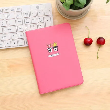 Leather handbook notebook 36K with 112 beige pages closed, showing blue red and white colour options