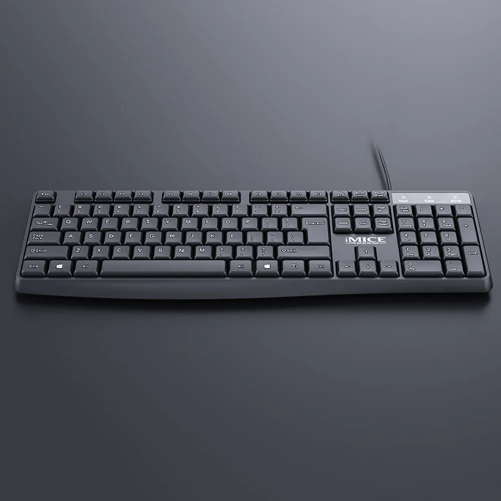 Black KM-520 wired keyboard and mouse set showing 104-key keyboard and optical mouse with USB cables