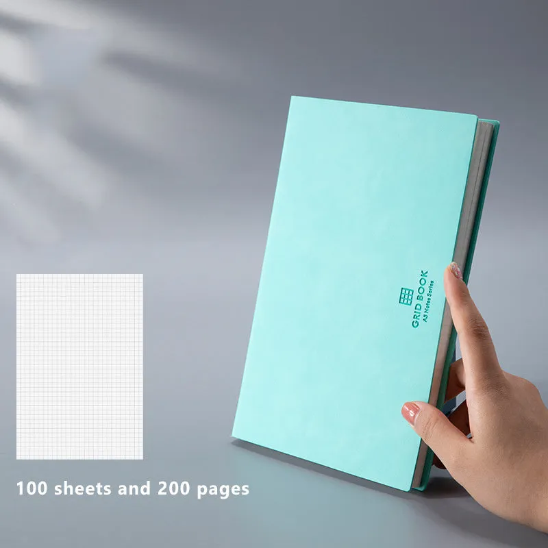 Grid book with hand-painted square grid, PU cover in lake blue, locking plastic binding, A5 size
