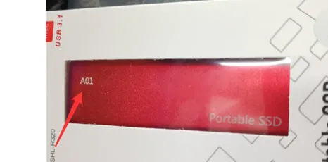 Ultra-thin external mobile solid-state drive with a metal shell, showing red interface connector.
