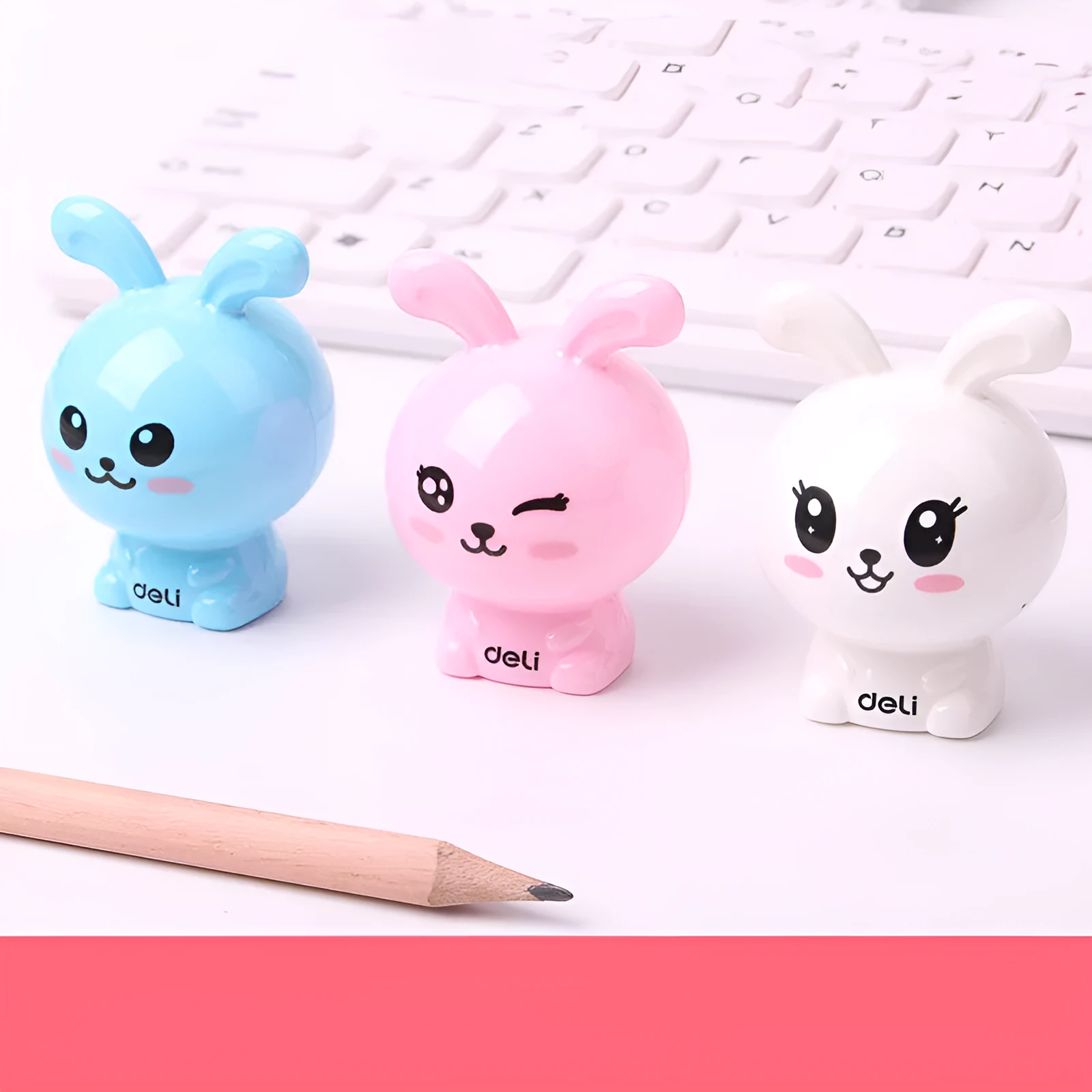 Mini cartoon pencil sharpener with random bunny design for children, plastic and metal construction