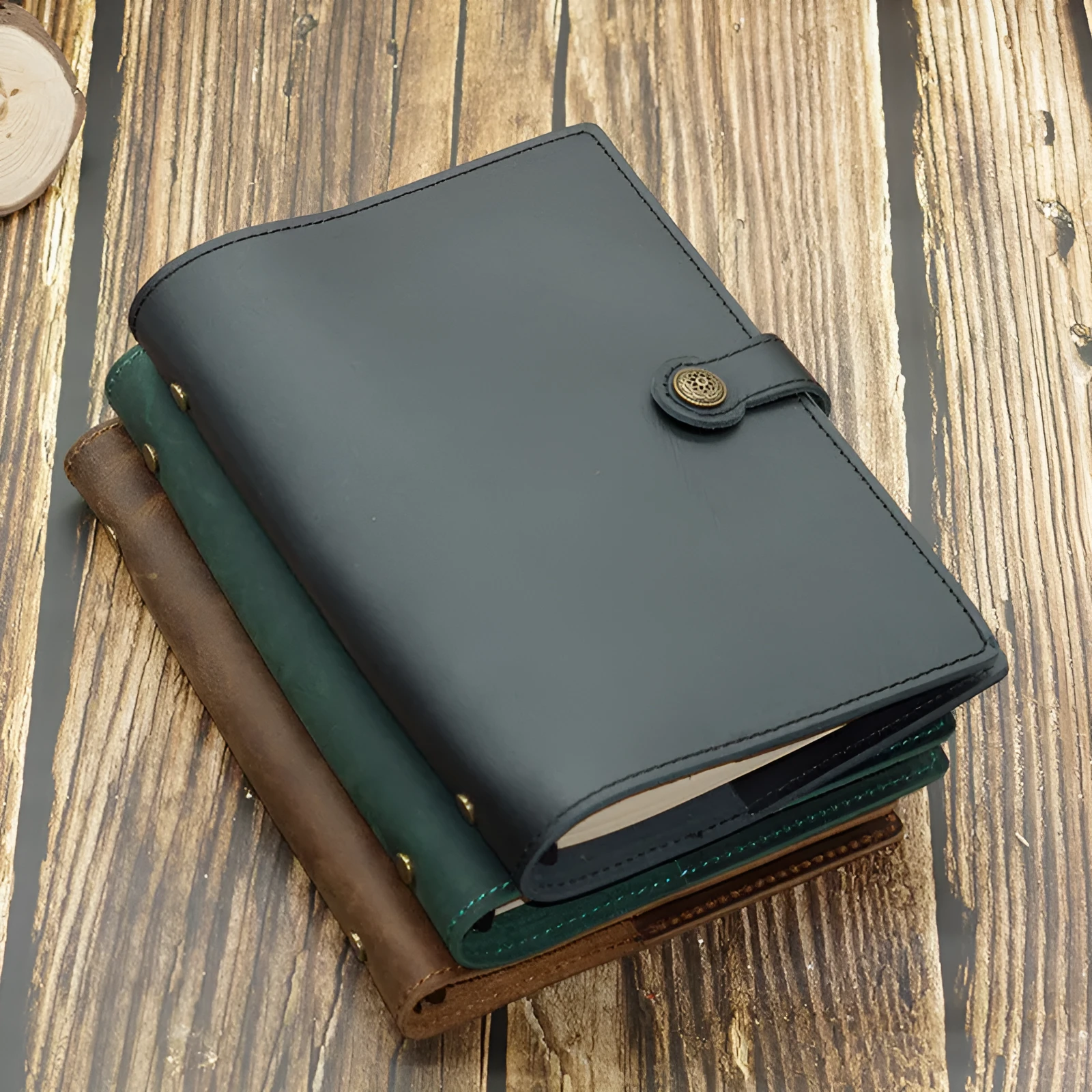 A5 handmade cowhide notebook with genuine leather cover in Crazy Horse Brown, opened on a table