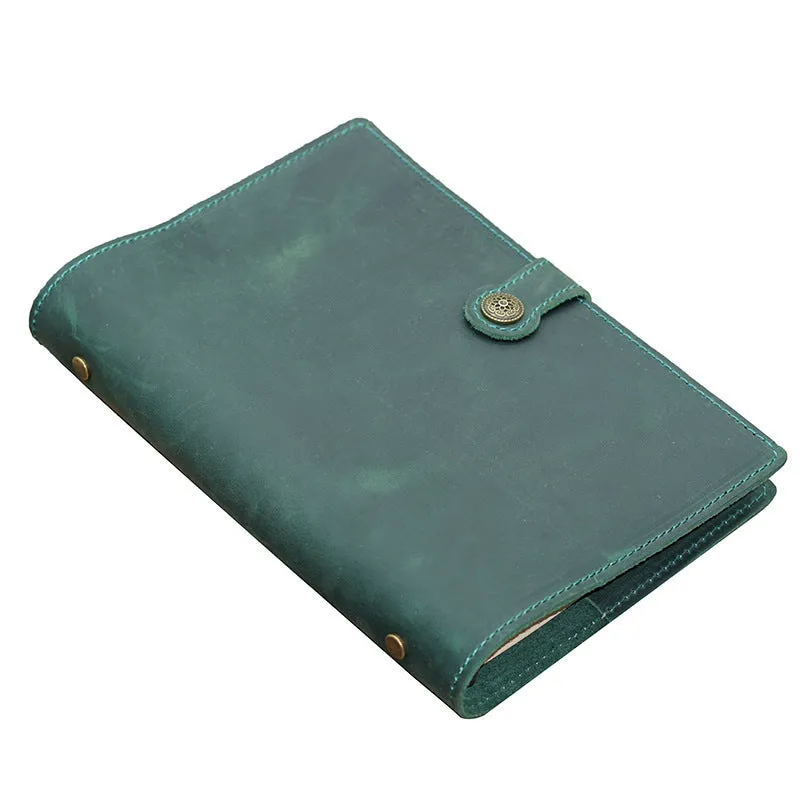 A5 handmade cowhide notebook with genuine leather cover in Crazy Horse Brown, opened on a table