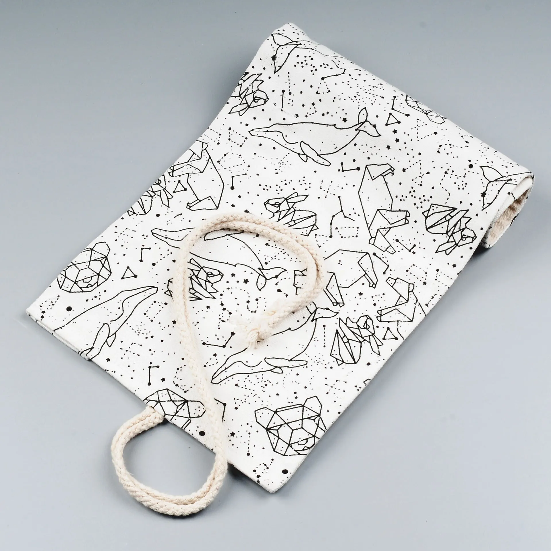 Canvas pencil case roll with starry sky pattern showing organised colour pencil slots