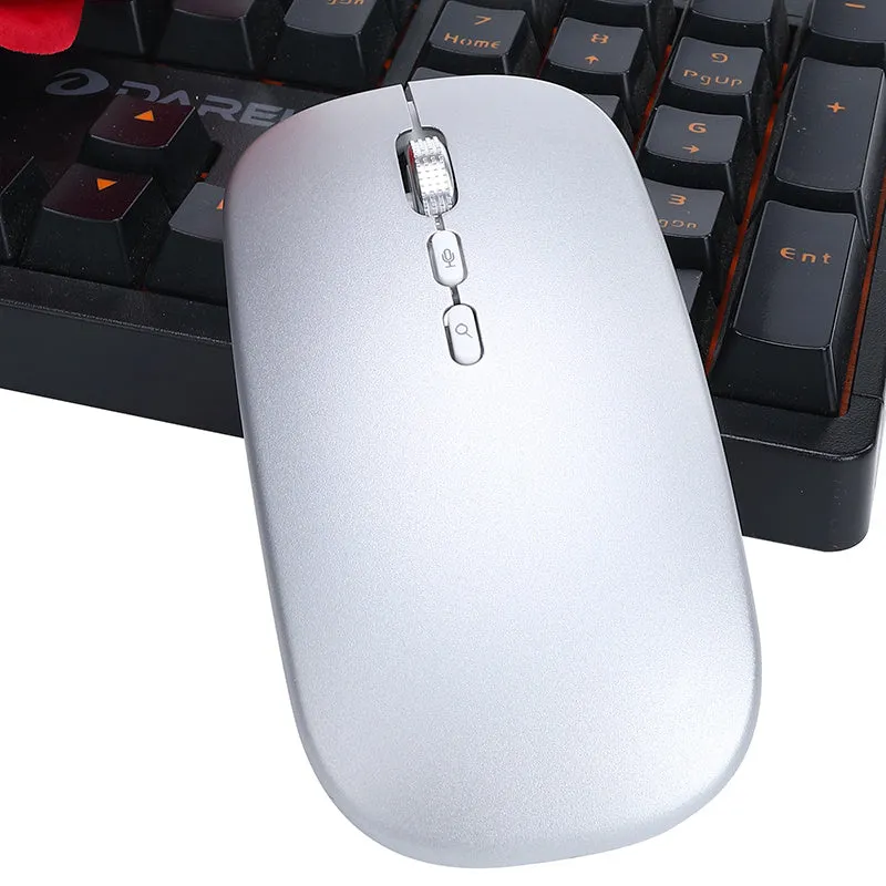 Silver intelligent voice mouse with voice typing translation and wireless charging on desk
