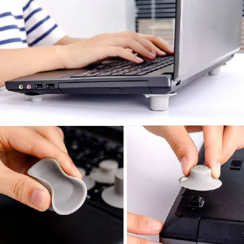 Set of four grey plastic non-slip cooling pads for laptops, two large and two small.