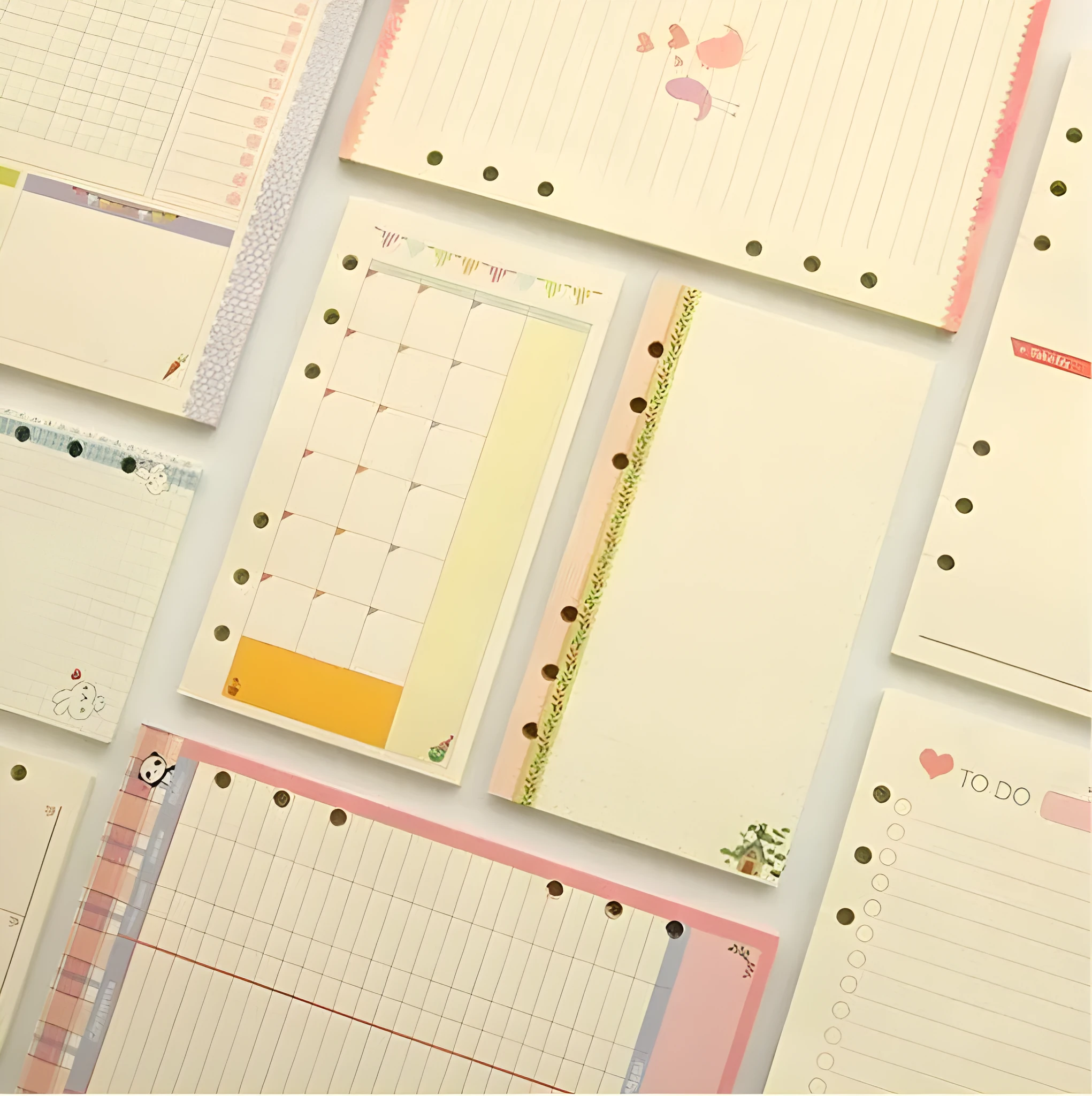 45 sheets of coloured A5 A6 binder filler paper with multiple ruling styles for planners and diaries