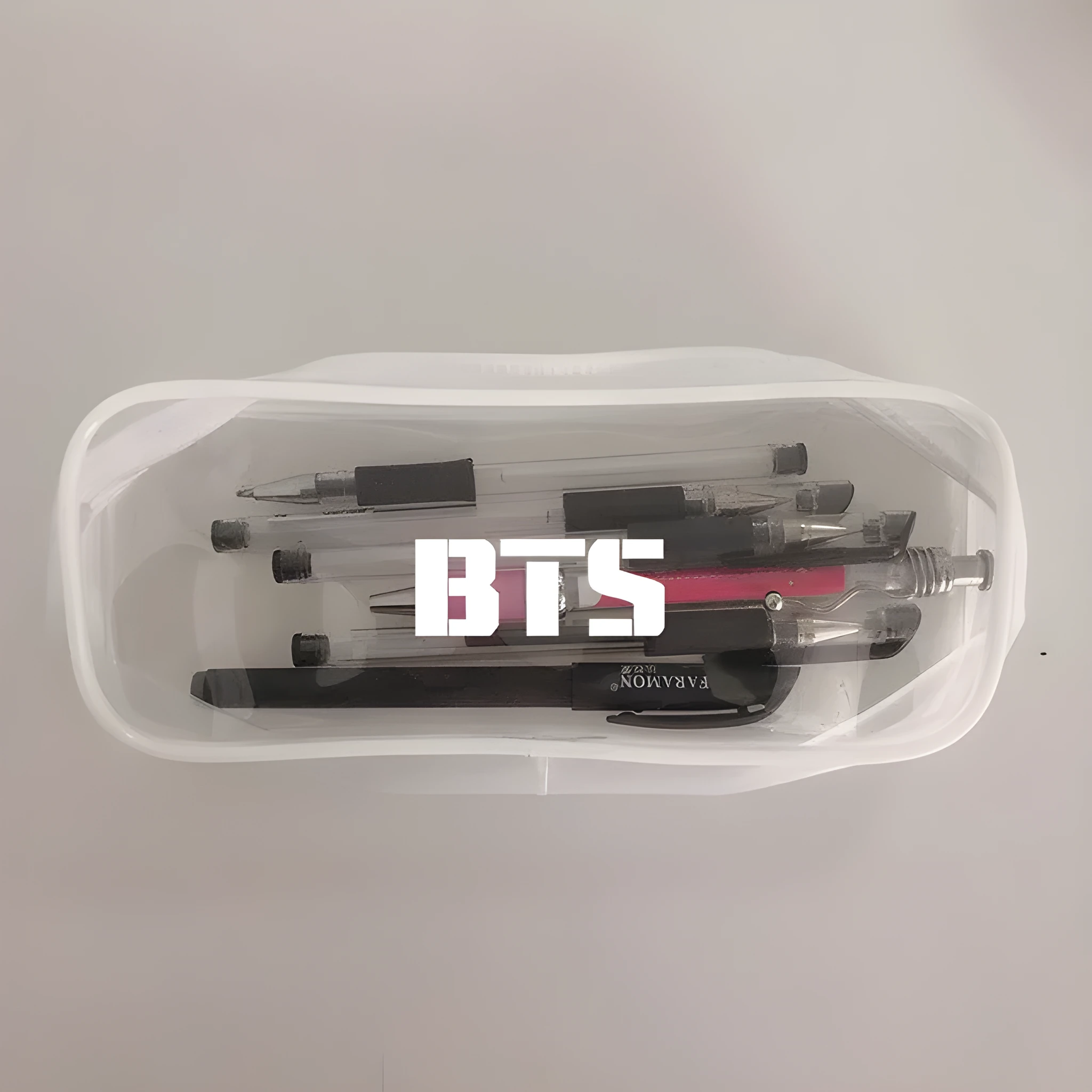 Transparent silicone pencil case with Kpop light stick design showing pens inside