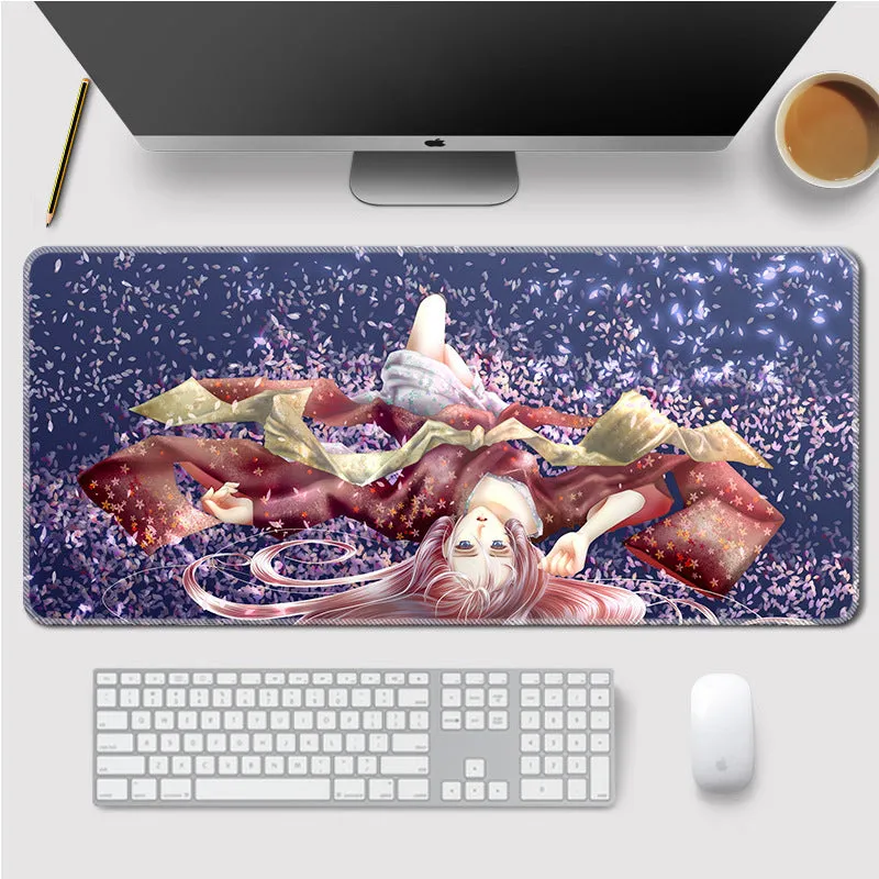 Landscape mouse mat with rubber base and cloth surface on a desk, showing heat transfer printed image