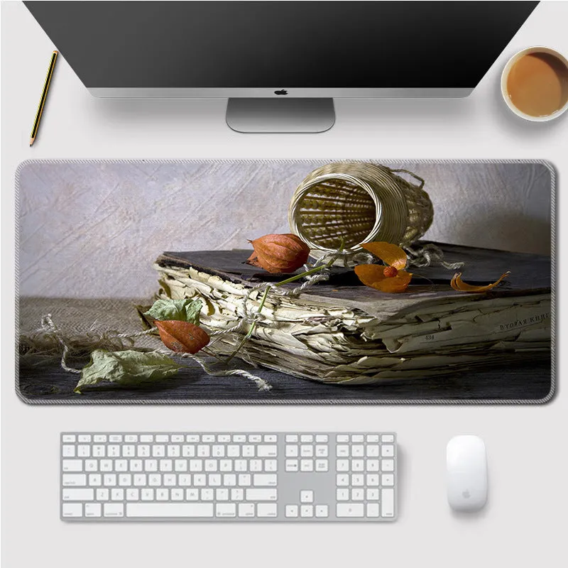 Landscape mouse mat with rubber base and cloth surface on a desk, showing heat transfer printed image