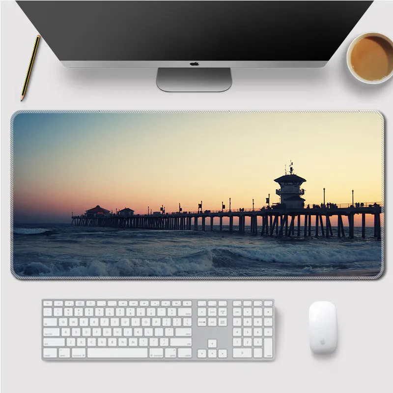 Landscape mouse mat with rubber base and cloth surface on a desk, showing heat transfer printed image